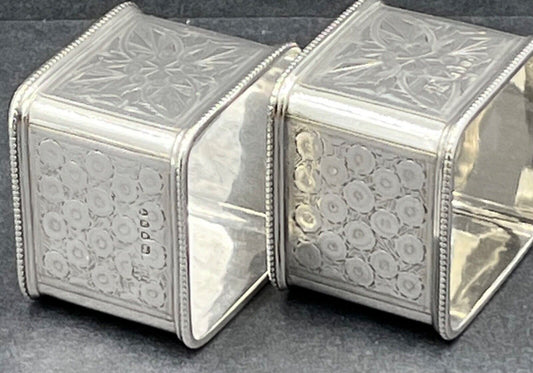 A good quality pair of Victorian sterling silver square napkin rings London 1888