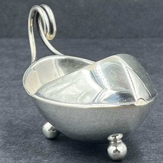 An unusual child's sterling silver feeding or medicine cup Sheffield 1909